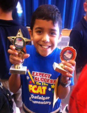 Marc proudly displays his awards